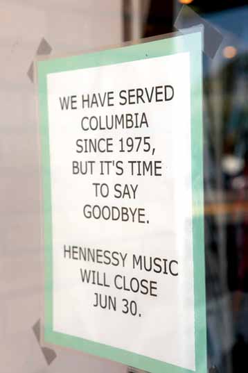 A goodbye note hangs on the door of Hennessy and Sons.