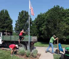 Crews work on a residential landscape installation in Columbia. The company completes hundreds of landscape projects in Missouri every year.