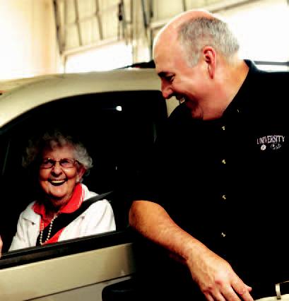 Longtime customer Ruth York shares a laugh with Dave Drane at University Chrysler Jeep Dodge.