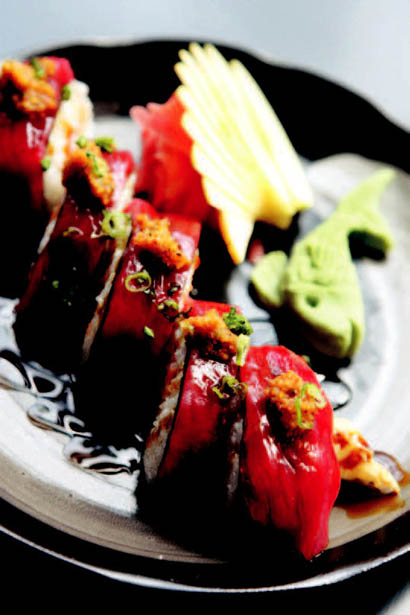 The Kampai roll is made of shrimp tempura, avocado and topped with spicy tuna.