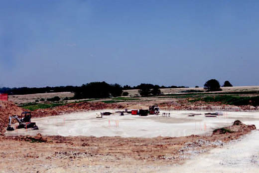 Despite 100 degree weather, construction crews managed to lay the foundation for the gymnasium at the high school.