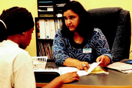 Director Manjula Narasimhan works with a student during a feedback session.