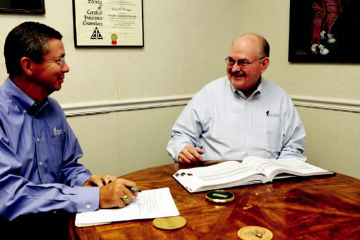 CEO of Columbia Insurance Group Bob Wagner, right, will pass the reins to Gary Thompson next year when he retires.