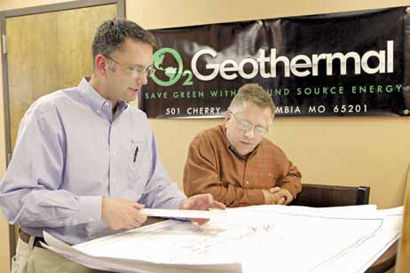 O2Geothermal owners David Ohnesorge and Jim Oakley review plans for a geothermal home.