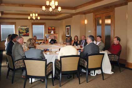 Two dozen people gathered at the Top of the Tiger Hotel for the Sports and Business Power Lunch and discussed ways to leverage the popularity of sports.