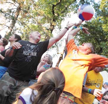 Crowd members bounce beach balls through the air as they jam out with the Itals in Peace Park.