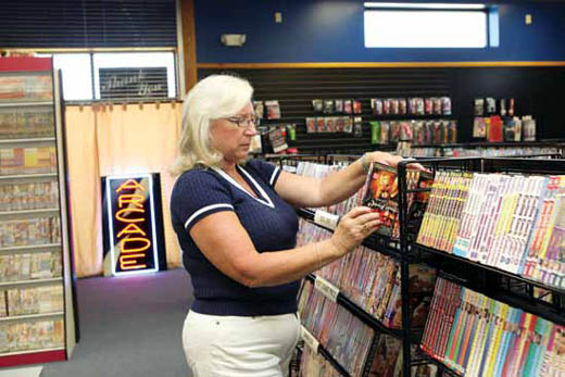 Nellie Symm-Gruender organizes movies at her adult store, Passions.