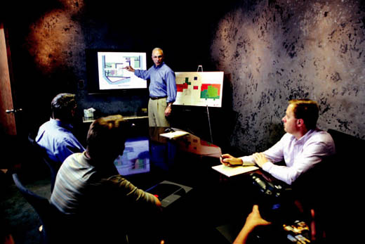 Randy Coil, of Coil Construction Inc., presents a project for a promotional video at his company.