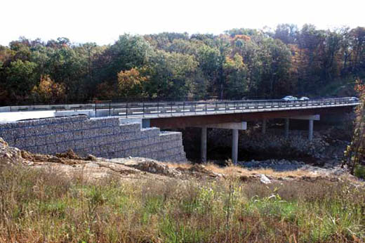 The Bridge over Grindstone Creek is expected to be completed within a month after the city and contractor agreed on a repair method that didn’t require disassembling the failed wall.