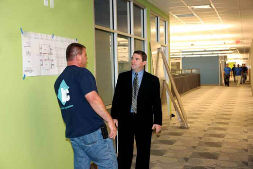 Chapdelaine talks with project manager Robert Worthington.