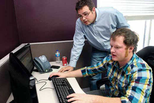Kayser and Devin Burrow go over inancial statements at SuretyBonds.com.