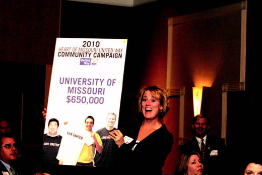 Mitzi Clayton, MU assistant athletic director, holds up a sign showing the initial tally of the money raised for the United Way by MU employees.