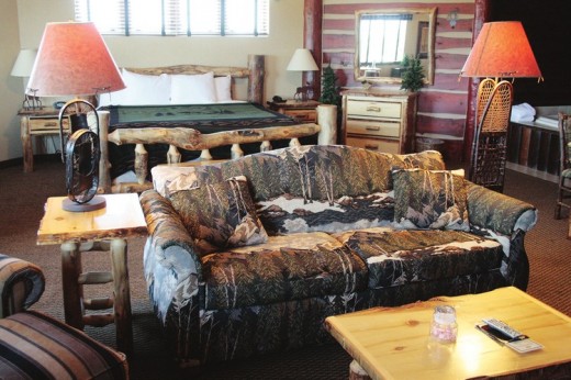 The Stoney Creek Inn, a themed hotel, features a log cabin feel and rustic décor, such as the bed made from real logs in the Northern Exposure room.