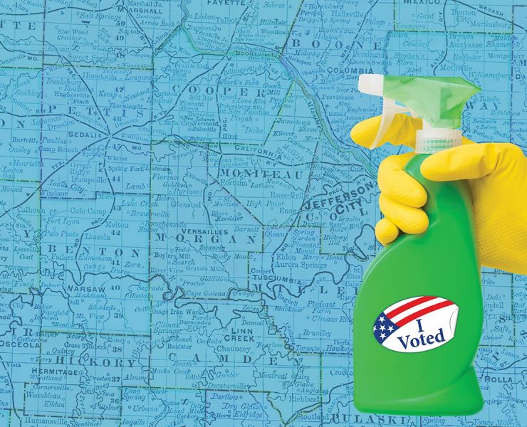 A gloved hand holds a green spray bottle with an I Voted sticker on it against a blue map background.