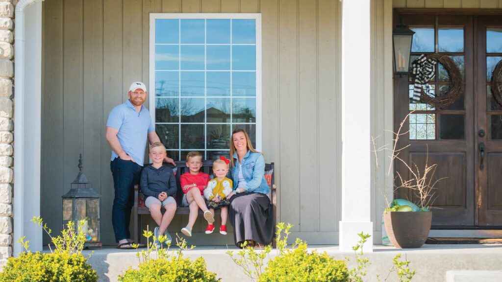 The Dyer family of Columbia on their front porch posing for the Front Door Project