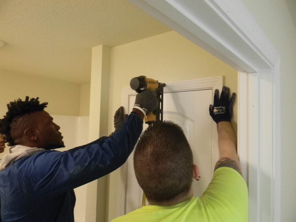 Two men work on home construction