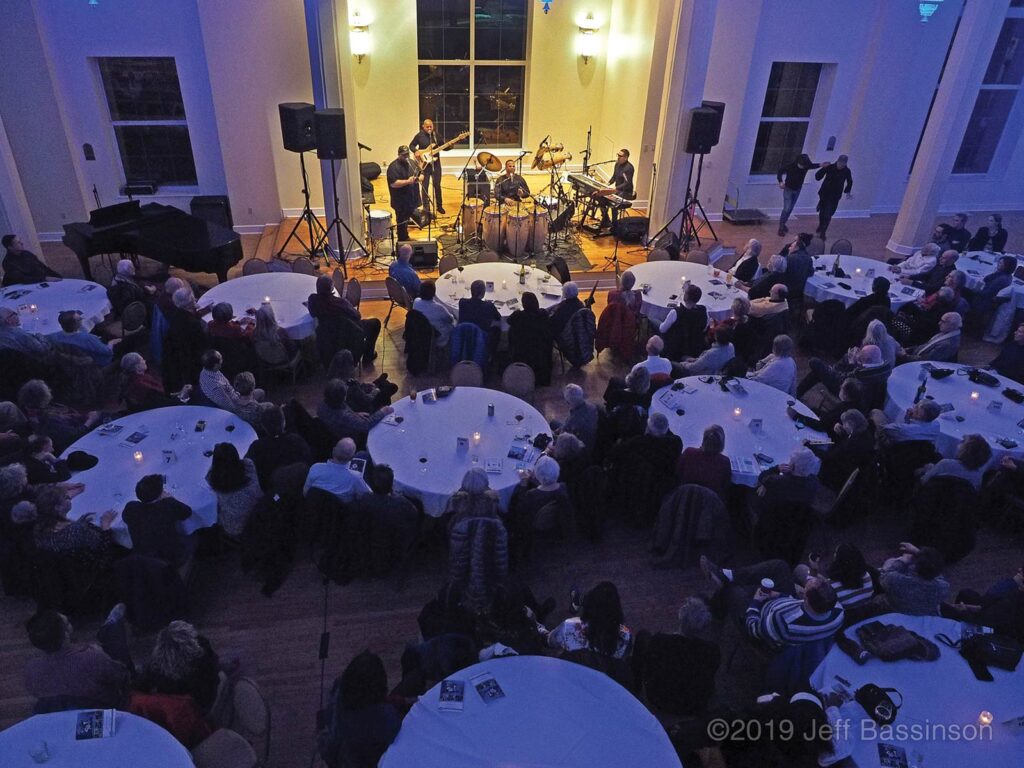 Jazz band plays for large group of people