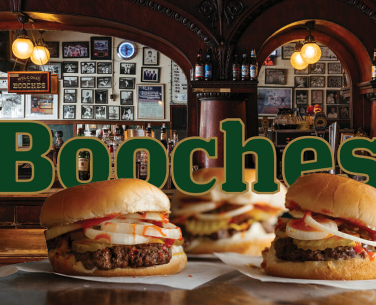 3-Booches-Burgers-Overlaying-the-word-Booches-in-green-text-outlined-in-gold-with-the-Bar-in-the-background