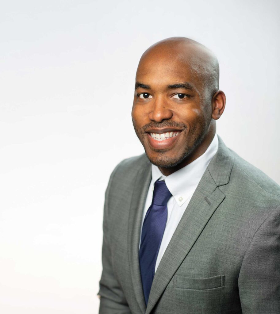 Headshot of a man in a suit named David Seamon against a white wall