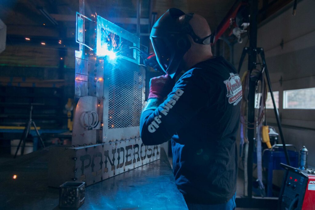 a man wielding a metal project