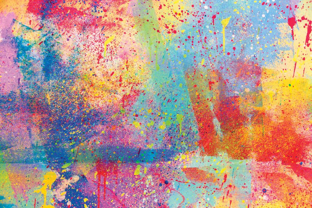 a close up painting featuring rainbow paint splatters