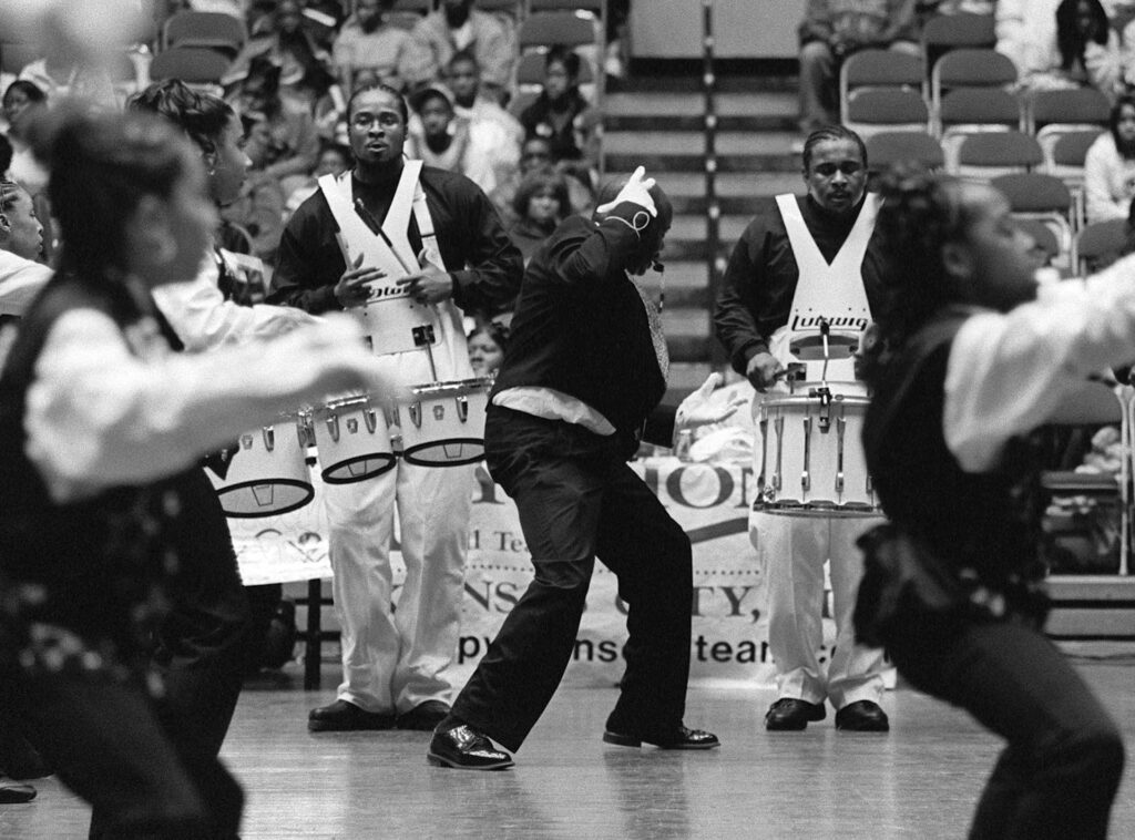 A black and white image of the Missouri high steppers preforming live