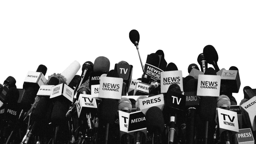 graphic of press microphones clustered together in front of a empty podium