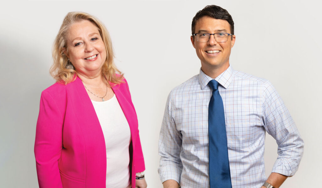 Headshot of a women and man against a white background