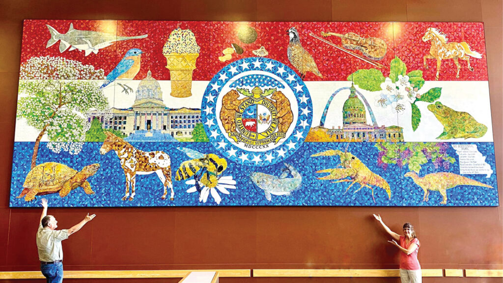 artists named Aaron Horrell and Barb Bailey by a large scale Missouri bicentennial mural