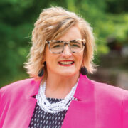 Close up headshot of a women named Michelle Batye standing outside