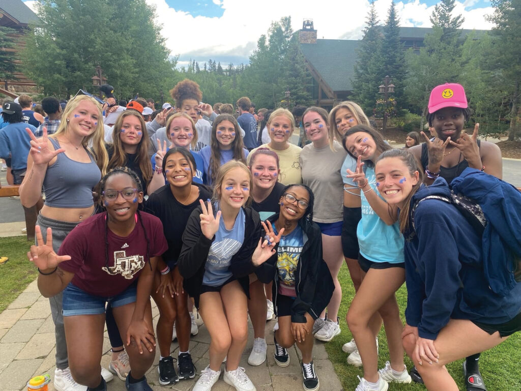 Group of attendees at the Young Life summer camp outside at Crooked Creek Ranch