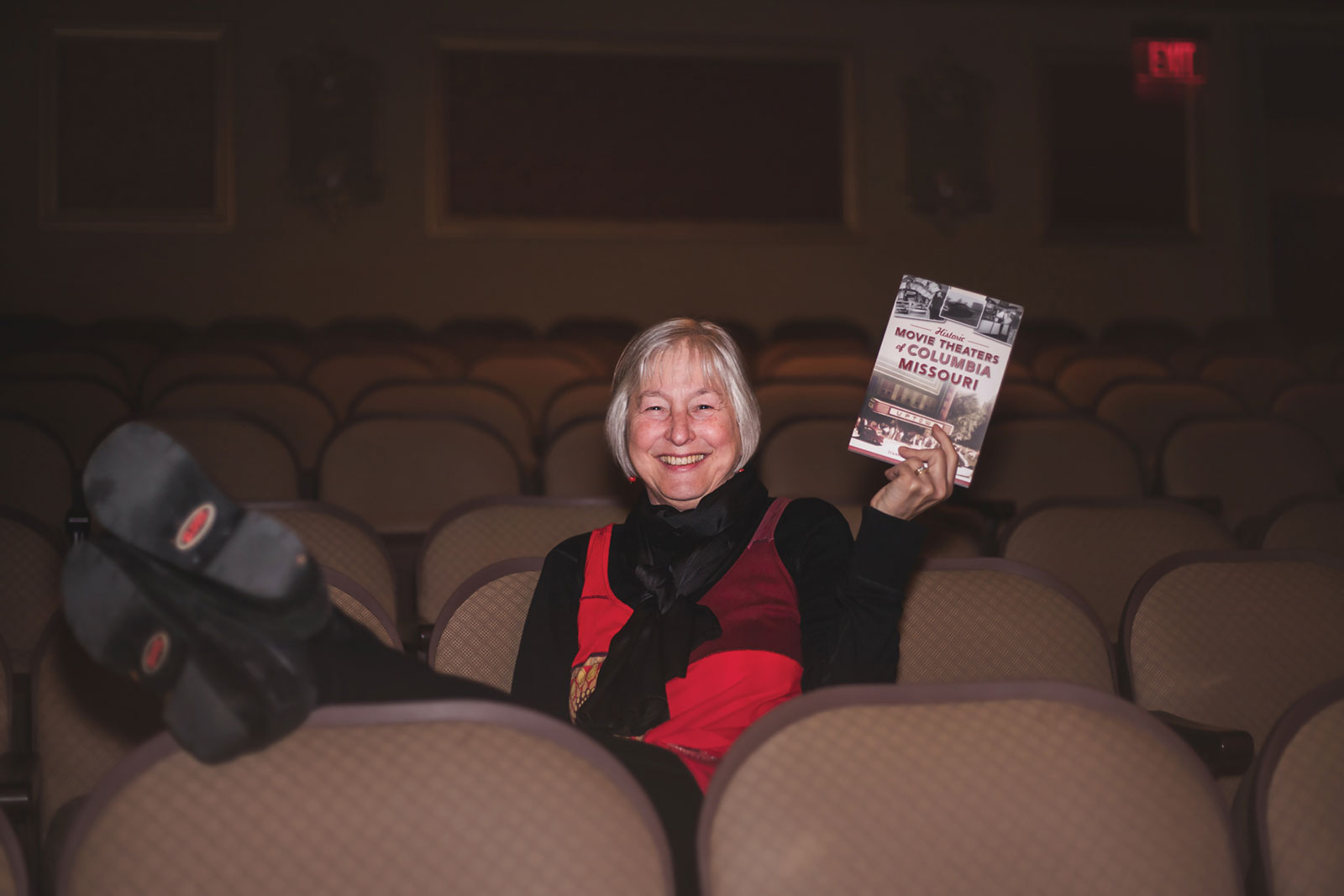 Dianna Borsi O’Brien holding her book, Historic Movie Theaters of Columbia, Missouri