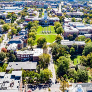 A bird's-eye view of downtown Columbia looking south toward and over the Mizzou campus, with Jesse Hall in the background.