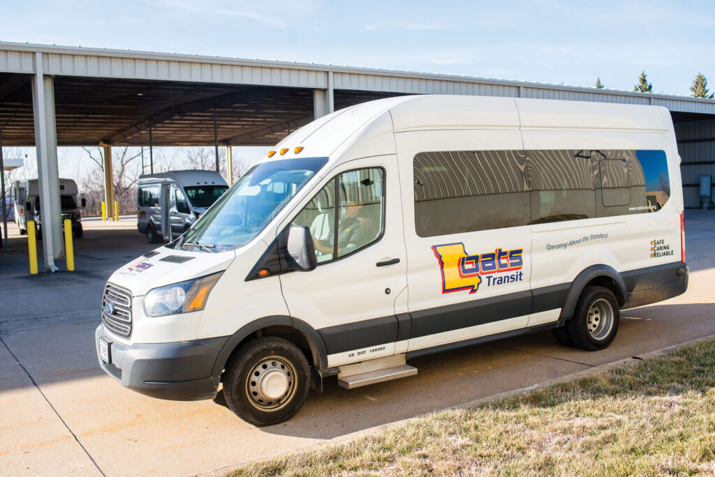 exterior shot of a white OATS transit van with the logo on the side