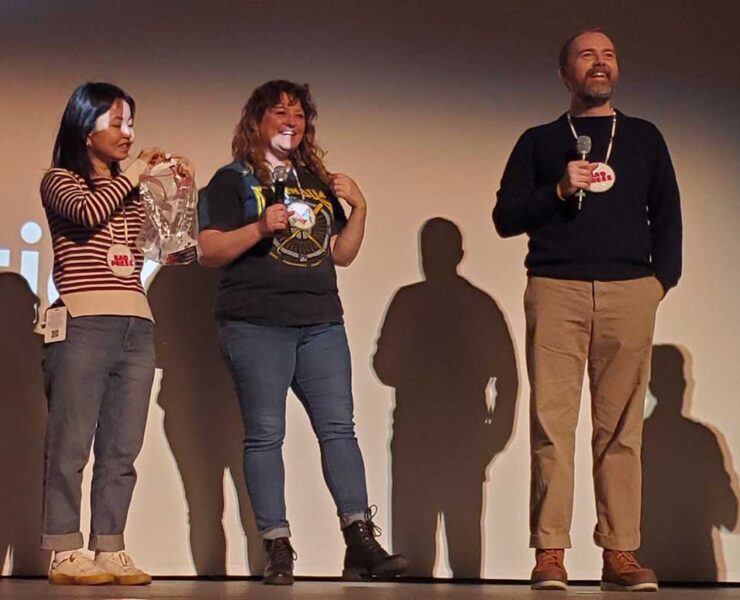 Angel Ellis, center in photo, was the recipient of the True Life Fund at the 2023 True/False Film Fest in Columbia, Missouri. Angel appears on stage after the third screening of the film Bad Press on Sunday, March 5, 2023, at the Missouri Theatre.