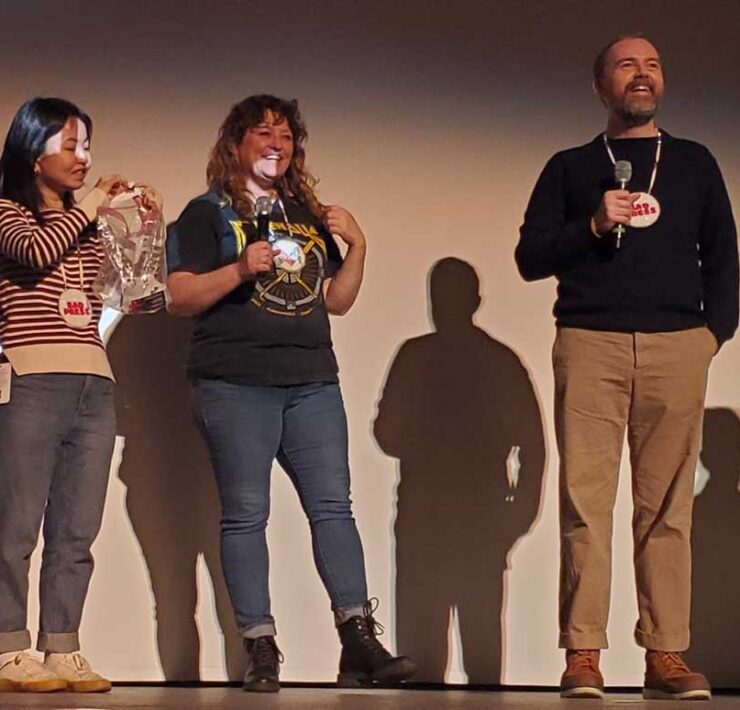 Angel Ellis, center in photo, was the recipient of the True Life Fund at the 2023 True/False Film Fest in Columbia, Missouri. Angel appears on stage after the third screening of the film Bad Press on Sunday, March 5, 2023, at the Missouri Theatre.
