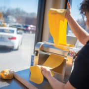 Shelly La Fata Pulling Pasta Through A Press