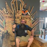 The owner of Witches And Wizards Arcade sits on the venue's throne