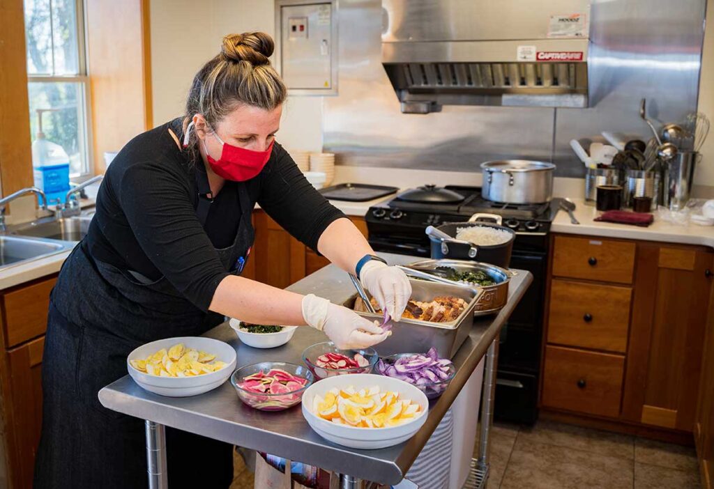 Windsor Street Montessori School Chef Gaby Weir Vera prepares lunch for students.