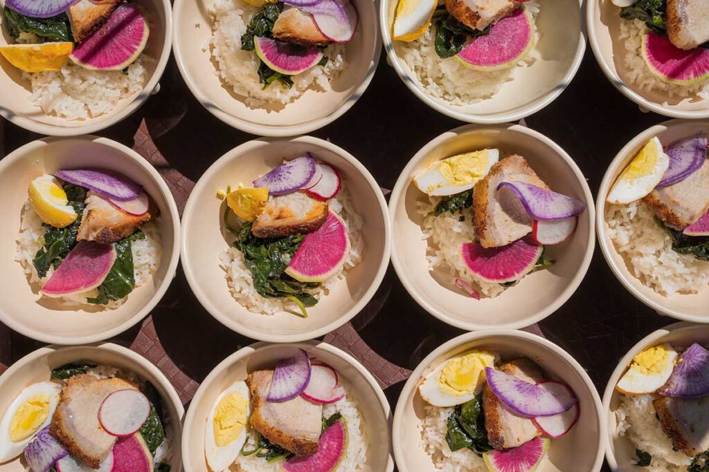 Plates of colorful food arranged for a photograph by Ben Nickelson Photography