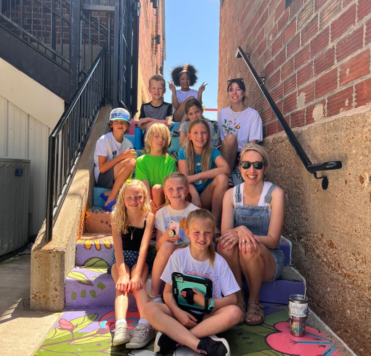 Wendi Jensen Poses In The North Village With A Summer Camp Group Of Kids