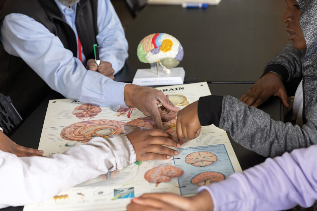 Dr Ellis Ingram Hands On Learning with students on the anatomy of the human body