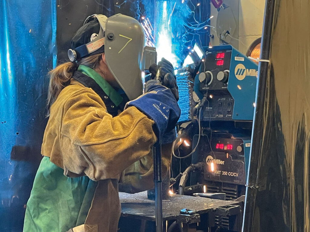 a young women Welding