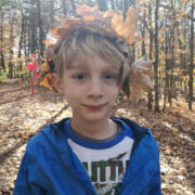 Young boy in a leaf crown