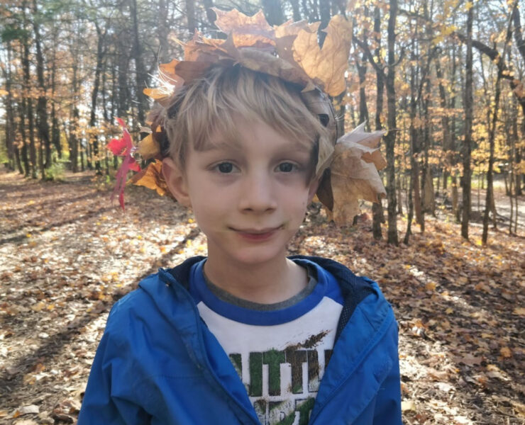 Young boy in a leaf crown