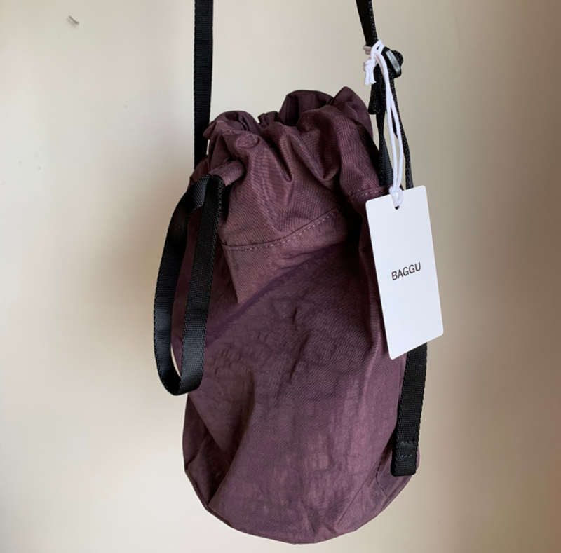 A fashionable handbag known as Baggu, from Columbia boutique Hedda, hangs on a hook