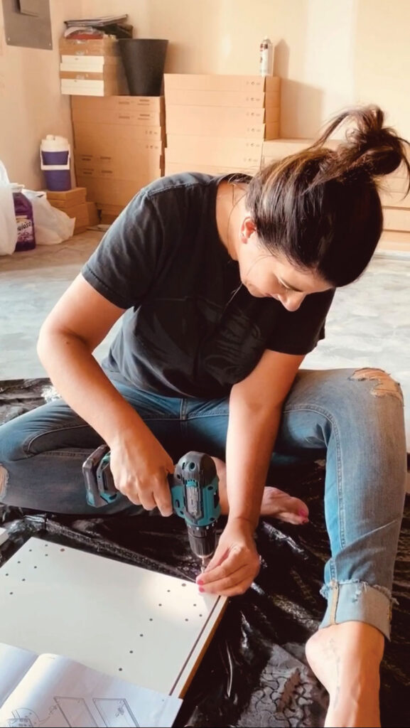 Kim Ambra using a power tool for the first time. 