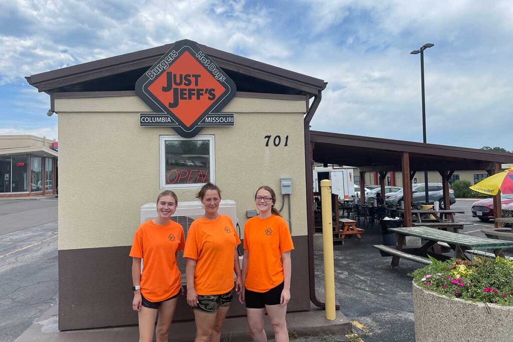 The team at Just Jeff's, clad in their signature orange t-shirts.