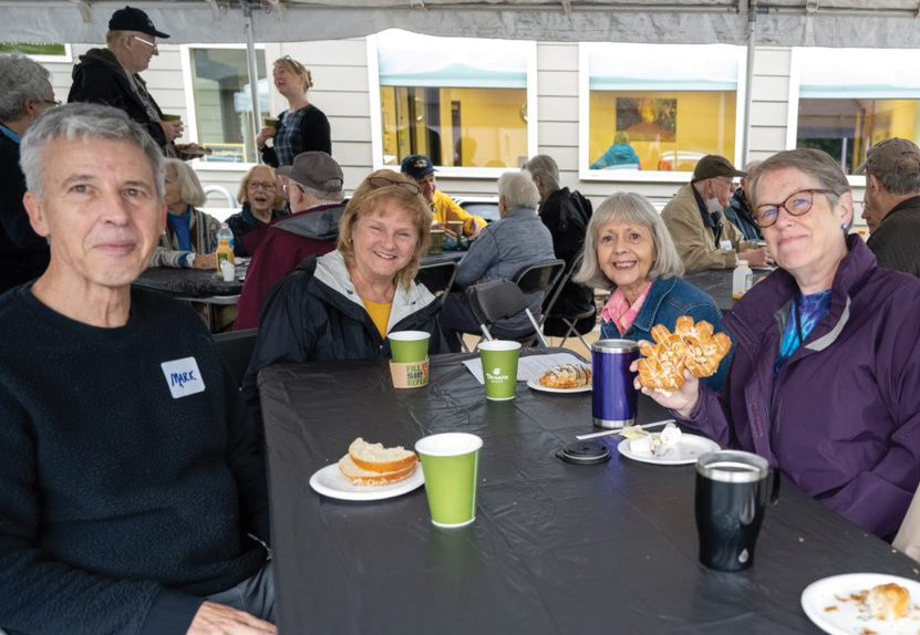 Smiling table of Osher learners at event