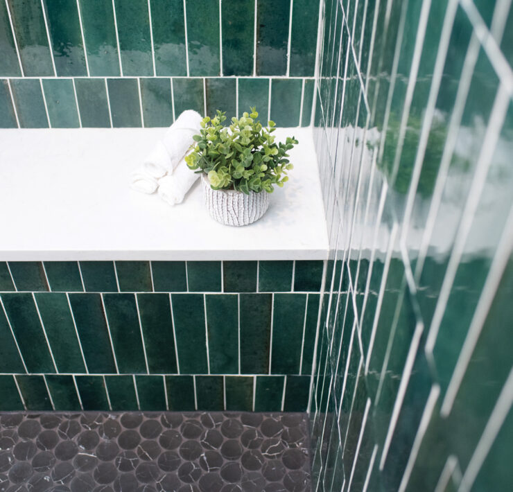 Decor details in green tiled shower